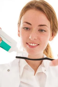Dentist with brush and tooth paste Female dentist online ,model released, ... Stock Photos