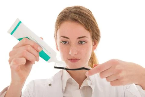 Dentist with brush and tooth paste Female dentist with tooth paste and bru... Stock-Fotos