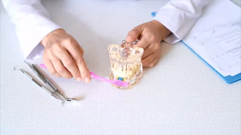 Dentist brushing teeth Stock Footage 65775541