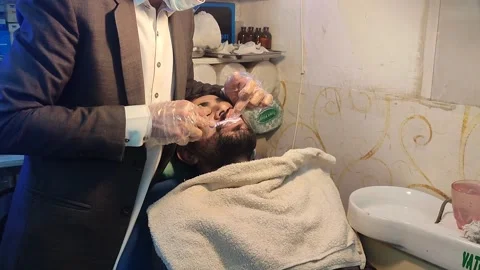 Dentist Brushing Teeth of patient during Dental teeth cleaning and whitening 動画素材 232931380