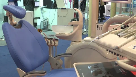 Dentist chair and various tools at dentistry exhibition Stock Footage 87968002