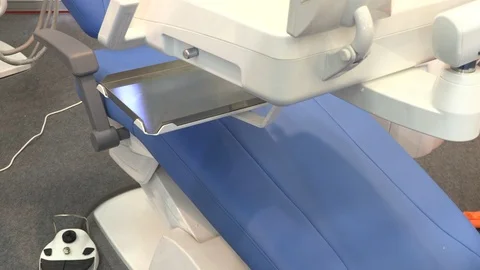 Dentist chair with various tools at dentistry exhibition Stock Footage 88192923