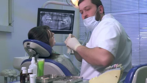Dentist changes the tools during dental treatment Stock Footage 72802807