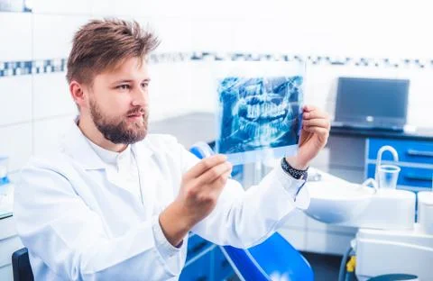 Dentist checking x-ray result Stock Photos