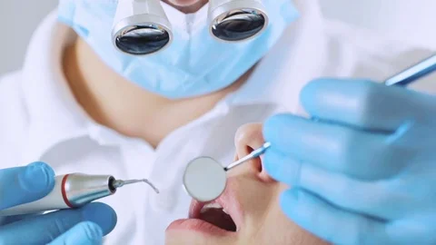 Dentist checking up a young female Stock Footage 82064536