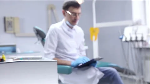 The dentist checks the mouth using tools. Point of view of patient in chair. Stock Footage 62133793
