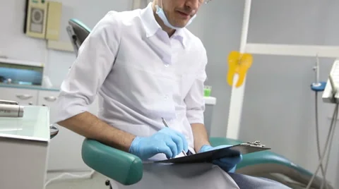 The dentist checks the mouth using tools. Point of view of patient in chair. Stock Footage 62133848