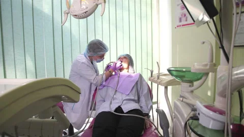 Dentist Cleans Patient's Teeth Stock Footage
