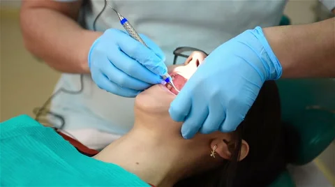 Dentist Conducting An Operation Stock Footage 63952617