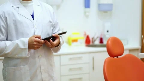 Dentist consulting patient data on tablet in dental clinic Stock Footage 295626503