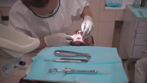 Dentist curing the patient Stock Footage 71055542