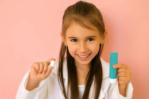Dentist demonstrates a toothpaste for brushing teeth. Stock Photos