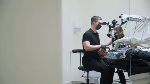 Dentist does an operation on technological equipment Stock Footage 112134904