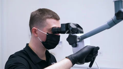 Dentist does surgery with special equipment Stock Footage 112141828