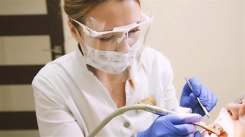 Dentist drills teeth Stock Footage 112530938