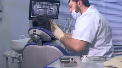 Dentist during operation with a patient Stock Footage 72798244