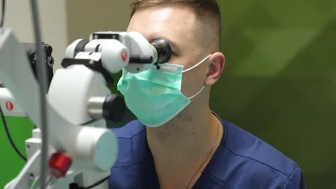 A dentist examines installed veneers in a modern clinic Stock-Footage 235678178