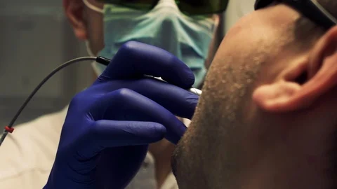 Dentist examines patients teeth with tools Video stock 128710757