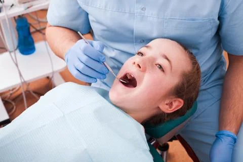 Dentist examines the teeth Stock Photos