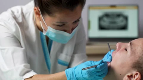Dentist examining the boy teeth, close-up. Stock Footage 253881485