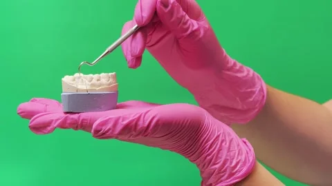 Dentist Examining Molar Teeth with Dental Explorer on Green Screen Stock Footage 337106704