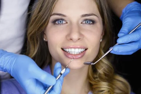 Dentist examining a patient's teeth in the dentist Stock Photos