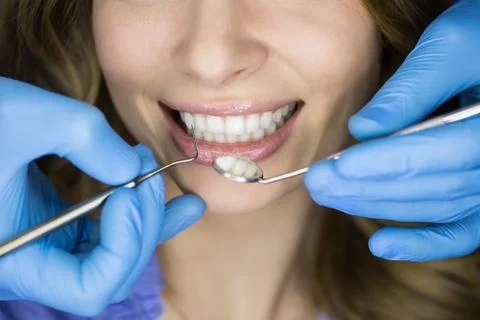 Dentist examining a patient's teeth in the dentist Stock Photos