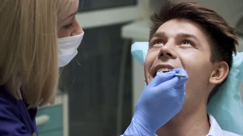 Dentist examining teeth Stock Footage 66409311