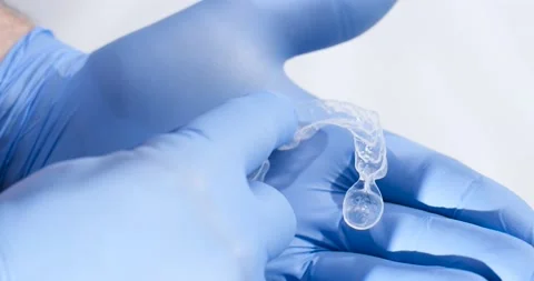The Dentist explains how to properly use Teeth Whitening Splints. Stock Footage 170957572
