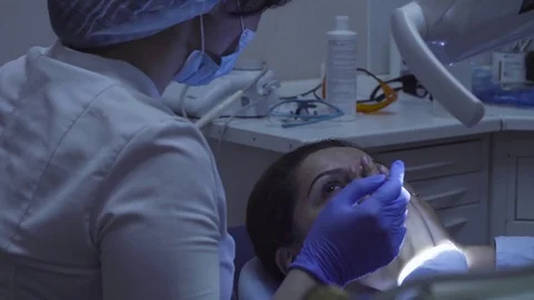 The dentist explains something to the patient Video stock 78243369