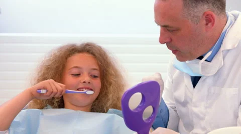 Dentist explaning how to brush Stock Footage 54279068
