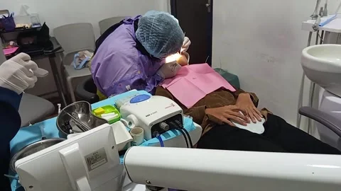 Dentist with face covered with a mask Stock Footage 299683757