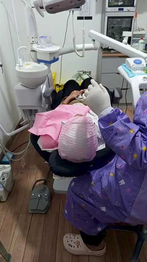 Dentist with face covered with a mask Stock Footage 299683830
