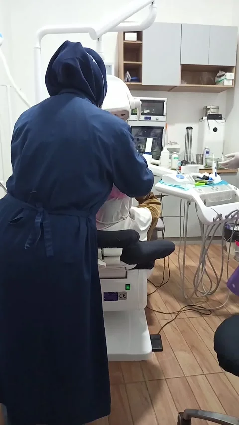 Dentist with face covered with a mask Stock Footage 299699629
