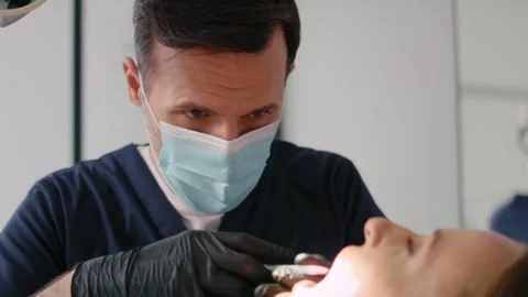 Dentist giving anesthesia to the patient Stock Footage 274141013