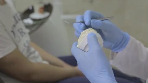 Dentist hand with jaw Stock Footage 75986416