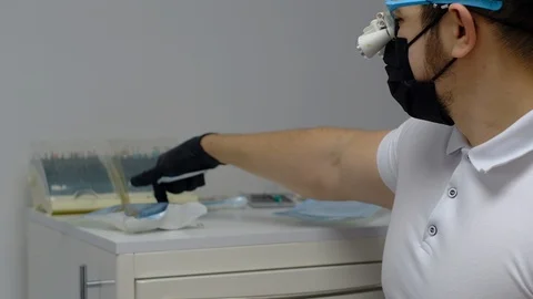 Dentist heals and whitens teeth Stock Footage 124579267