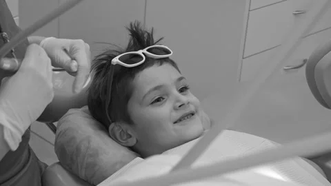 Dentist inspecting checked a child's teeth Stock Footage 158446947