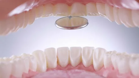 Dentist inspects teeth with mirror Stock Footage 139637220
