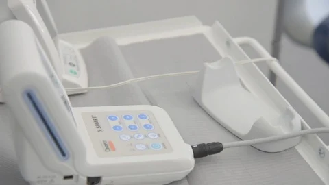 Dentist keeping tool on stand in clinic Stock Footage 89976734