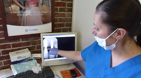 Dentist Looking at X-rays Stock Footage 42882203