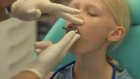 Dentist makes a bite cast in a child Stock Footage 115910128