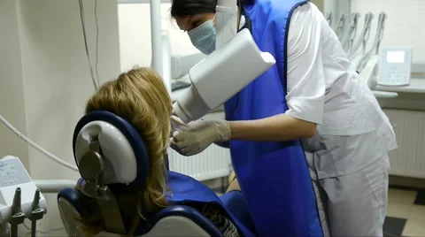 Dentist makes teeth X-rays to the patient Stock Footage 66692835