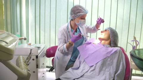 The dentist is making anesthesia to the patient Stock Footage 85516724