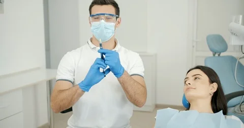 Dentist Making Anesthesia to Patient 動画素材 119330631