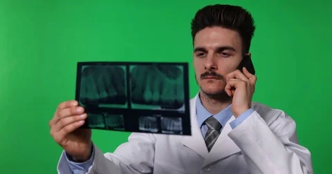 Dentist Man Negative Answer Look X-Ray Talk Mobile Phone Green Screen Background Stock Footage