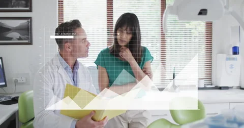 Dentist opening yellow folder, showing X-ray charts, explaining treatment while Stock Footage 316077921
