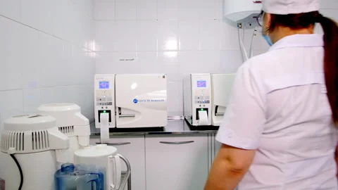 Dentist opens apparatus for drying and sterilization Stock Footage 239754764