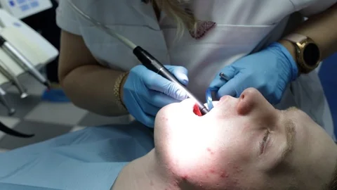 Dentist with a patien Stock Footage 123949409