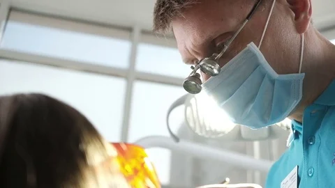 Dentist performing surgery using sterilised equipment. Dental care concept. Stock Footage 74586516